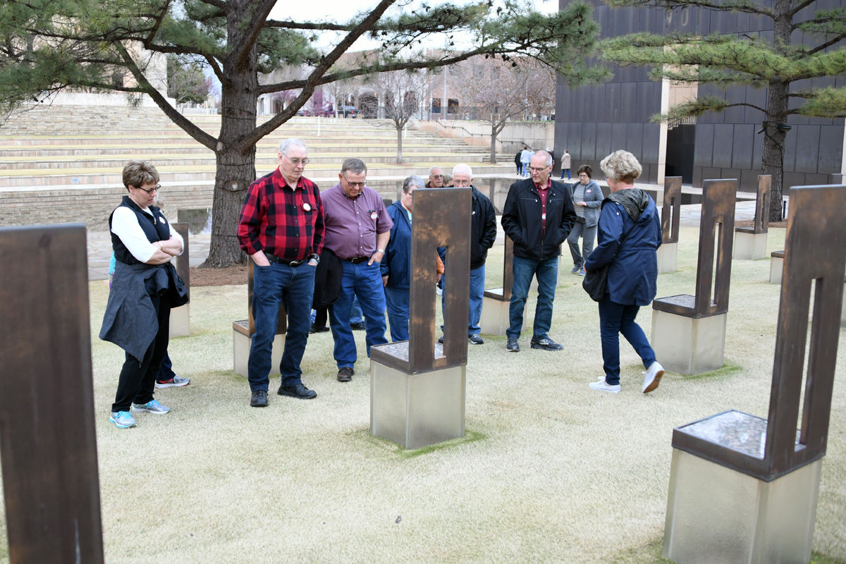 016 Fun Club travelers explore the Field of Empty Chairs at the Memorial.JPG